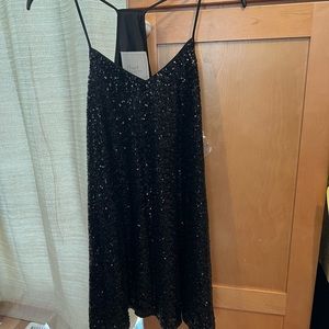 Black sequin mini dress. New with tags !